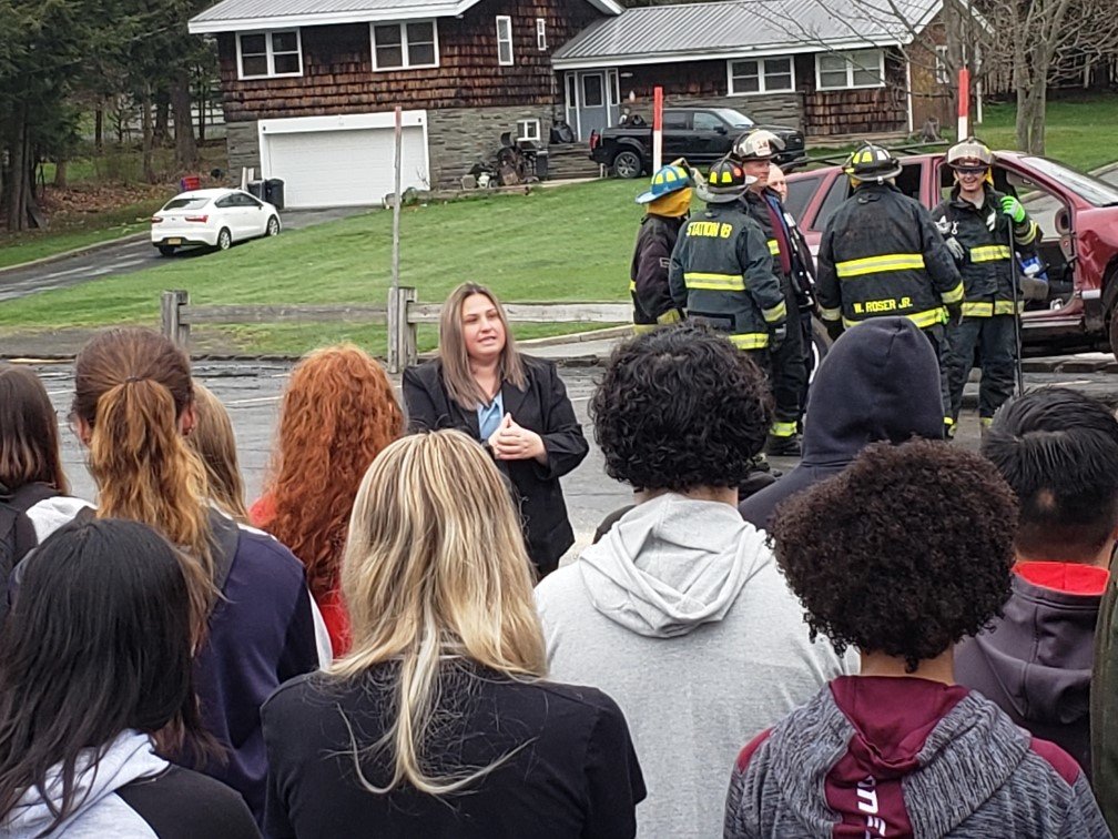 Sullivan County District Attorney Meagan Galligan speaks to students at Operation Prom Night. Some of the participating fire/EMS personnel are in the background.